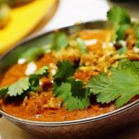 Naram Chara  (Nepalese Entree) · Boneless chicken curry, turmeric, onion, cilantro, tomato, garlic & spices. Served with Basm...