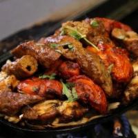 Turmeric House Special Grill · Combination of Tandoori Chicken, Chicken Tikka, Lamb Tikka, Lamb sheek kebab , Tandoori shri...