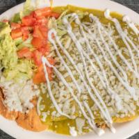 Enchiladas Suizas · Three enchiladas filled with your choice of meat and topped with tomatillo sauce and melted ...