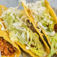 3 Soft Or Hard Tacos · Three soft or hard tacos with your choice of ground beef or shredded chicken topped with let...