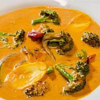 Panang Curry Bowl · Spicy and creamy Panang curry with zucchini, squash, and Thai basil