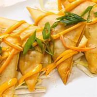 Crabby Wontons · Claw crabmeat seasoned and mixed with a light amount of cream cheese folded in a cripsy rice...