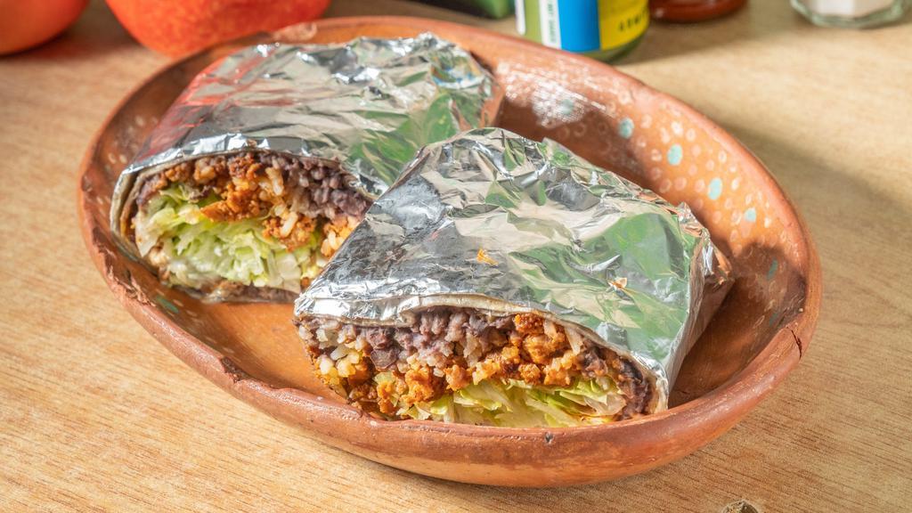 Burrito · Flour tortilla filled with beans, rice, lettuce, sour cream, and cheese.