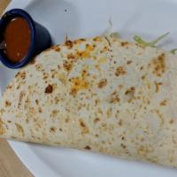 Quesadilla · Flour tortilla with cheese inside and lettuce, sour cream and more cheese with the choice of...