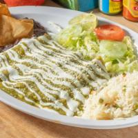 Enchiladas Verdes · Green sauce enchiladas comes a platter of four tortillas with chicken inside topped with sau...