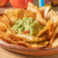 Guacamole · Mixed with tomatoes, onions and cilantro, and chips.