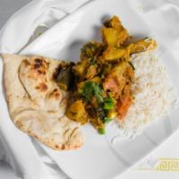 Baigan Bharta · Gluten free, vegetarian. Roasted eggplant, ground and cooked with mild spices.