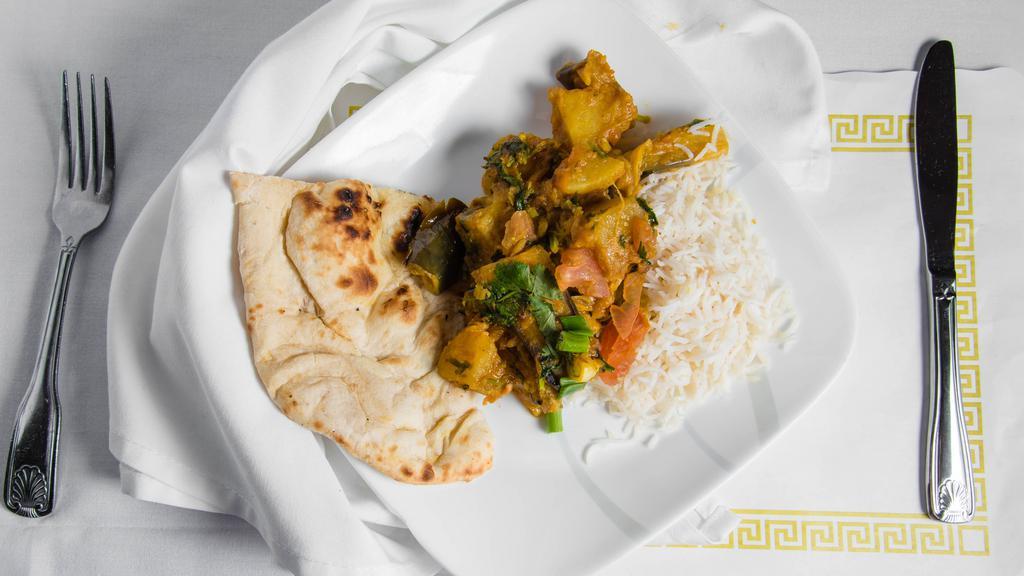 Baigan Bharta · Gluten free, vegetarian. Roasted eggplant, ground and cooked with mild spices.