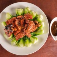 Chinatown Roast Duck · Chinatown style roasted duck with baby bok choy.