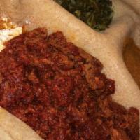 Kitfo · Ethiopian Beef Tartare with Ethiopian butter & powder chili . Served w/ayib & gomen.