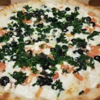 Greek Pizza · White pizza with spinach, fresh tomato, olives, roasted garlic and feta cheese.