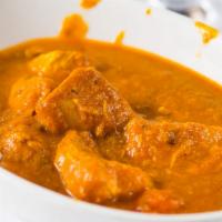 Chicken Curry · Boneless chicken cooked in thick curry sauce.