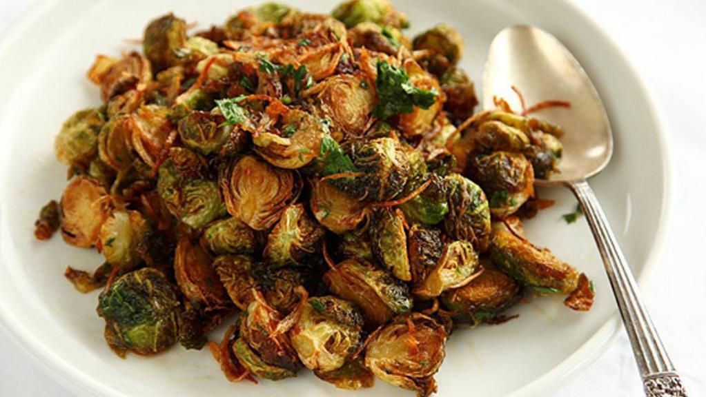 Crispy Fried Brussel Sprouts · Smoked paprika. Freshly shaved parmesan.