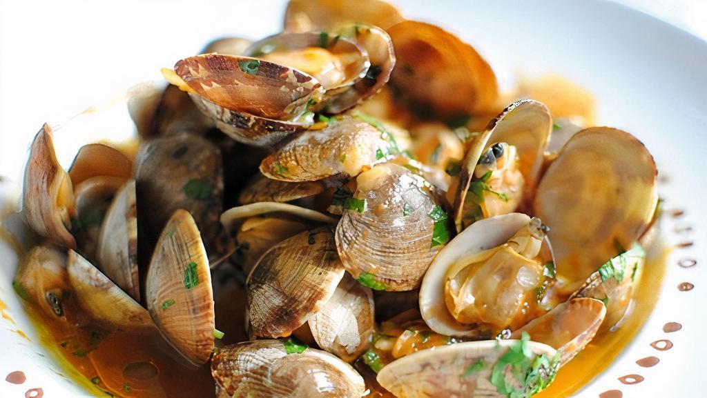 Pepata Di Vongole · Littleneck clams sautéed with garlic and Italian spices in white wine sauce or pomodoro sauce.