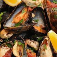Cozze Alla Francesca · Steamed mussels with garlic and Italian spices in white wine sauce or pomodoro sauce.