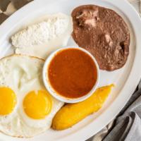 Huevos Rancheros · Sunny side up eggs, sour cream, beans, queso fresco, avocado, plantains, two tortillas, and ...