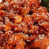  Sesame Chicken · Spring chicken cut into large chunks, marinated & quickly fried till crispy sautéed w. red p...