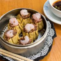 Shao-Mai · 6 pieces. Steamed dumplings stuffed with pork, shrimp, and vegetables. Served with ginger sa...