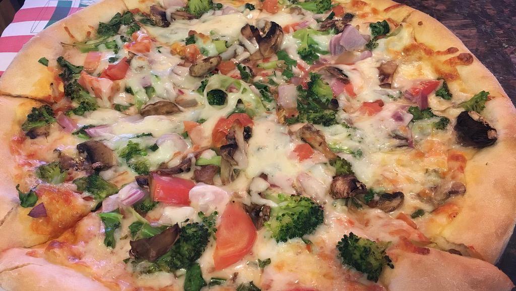 White Veggie Pizza · Broccoli, spinach, tomato, mushrooms and onions.