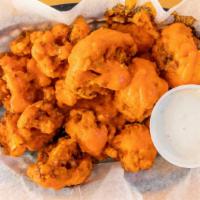Fried Cauliflower · Fresh cauliflower florets lightly battered and tossed in your choice of a sauce. Some of our...