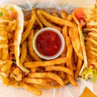 Fish Tacos · Locally sourced fried haddock in two soft tortillashells topped with shredded lettuce tomato...