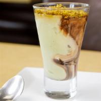 Coppa Pistachio · Custard gelato swirled together with chocolate and pistachio gelato, topped with praline pis...