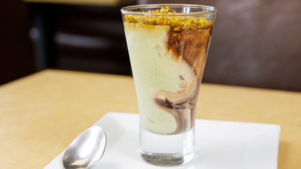 Coppa Pistachio · Custard gelato swirled together with chocolate and pistachio gelato, topped with praline pistachios.