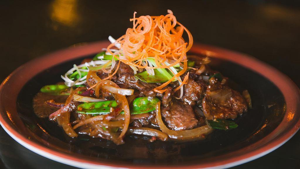 Mongolian Beef · Spicy. Sliced beef, snow peas, onions, and mild spicy hoisin sauce.