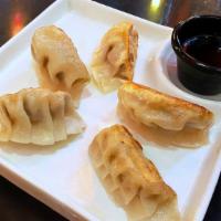 Potstickers Pork And Napa Cabbage Peking Style · Made fresh daily and pan crisped. Served with ginger-soy-vinaigrette and asian pickles.