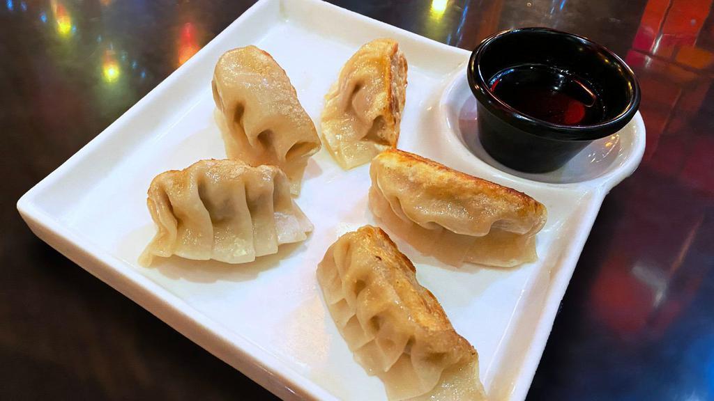 Potstickers Pork And Napa Cabbage Peking Style · Made fresh daily and pan crisped. Served with ginger-soy-vinaigrette and asian pickles.