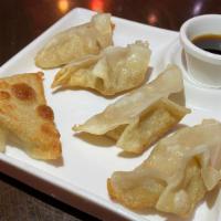 Potstickers Chicken And Water Chestnuts Cantonese Style  · Made fresh daily and pan crisped. Served with ginger-soy-vinaigrette and asian pickles.