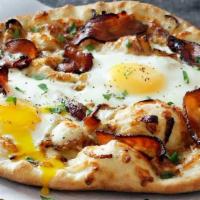 Breakfast Pizza · Sliced potatoes, bacon, ham, sausage, eggs and mozzarella.
