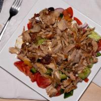 Horiatiki Salad · A truly traditional Greek salad. Fresh tomatoes, cucumber, red onion, feta, and Kalamata oli...