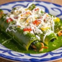 Spinach & Chicken Enchiladas · Three corn tortillas stuffed with chicken and spinach topped with our delicious roasted pobl...