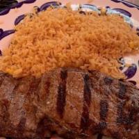 Carne Asada · Grilled tender ribeye steak, order of rice and beans, pico de gallo and two flour tortillas.