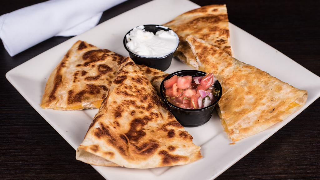 Celtic Quesadilla · A crispy grilled tortilla filled with melted cheese and fresh scallions with your choice of grilled chicken or pulled pork.