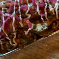 Pulled Pork Nachos · house made chips, slow roasted bbq pulled pork, cheddar cheese, pico de gallo, pickled red o...