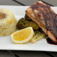 Salmon · grilled salmon topped a teriyaki glaze, corn rice pilaf & broccolini <br />