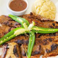 Costilla De Res Asada · Grilled Beef Short Ribs
Served with rice, beans and 2 corn tortillas