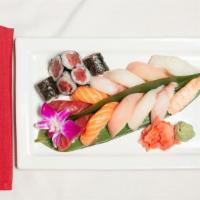 Sushi Deluxe · Six pieces of tuna roll and twelve pieces of assorted sushi.