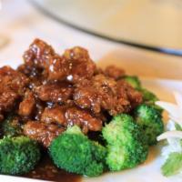 Orange Beef · Orange peels sautéed with sliced beef, scallions and hot pepper in sweet spicy sauce. Served...
