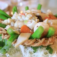 Seafood Bird'S Nest · The nest is edible and the most common ingredients are scallops, peapods, fish fillet, mushr...