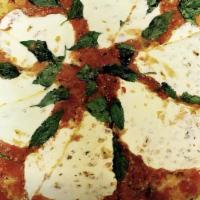 Margarita Pizza · Fresh mozzarella, tomato sauce and fresh basil.