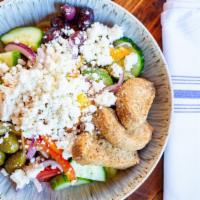 Greek Village Salad · Vegetarian. Tomato Medley, Red Onion, Cucumber, Pepper, Imported Caper Berries, Organic Gree...