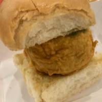 Vada Pav · Spicy potato filling sandwiched between buns and layers of spicy garlic and green chutney!