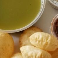 Pani Puri · Savory crunchy puri filled with potatoes & channa served with a tangy mint & tamarind sauce.