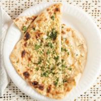 Garlic Naan · White flour naan with minced garlic garnished with cilantro.