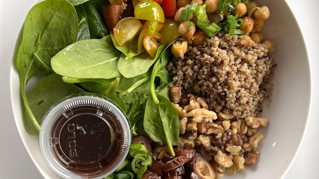 Quinoa Macro Salad · Chickpeas, Quinoa, Walnuts, Grape Tomatoes, Red Onions, Dates on Spinach paired with Fig Balsamic Vinaigrette
