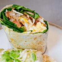 Breakfast Burrito  · Scrambled egg, chihuahua cheese, spinach, tomato, sauté onion, and hashbrown with your choic...