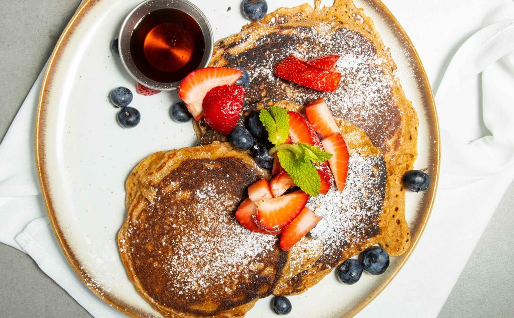 Pancakes · Buttermilk hotcakes, pure maple syrup, butter, powdered sugar, and assorted fresh berries.